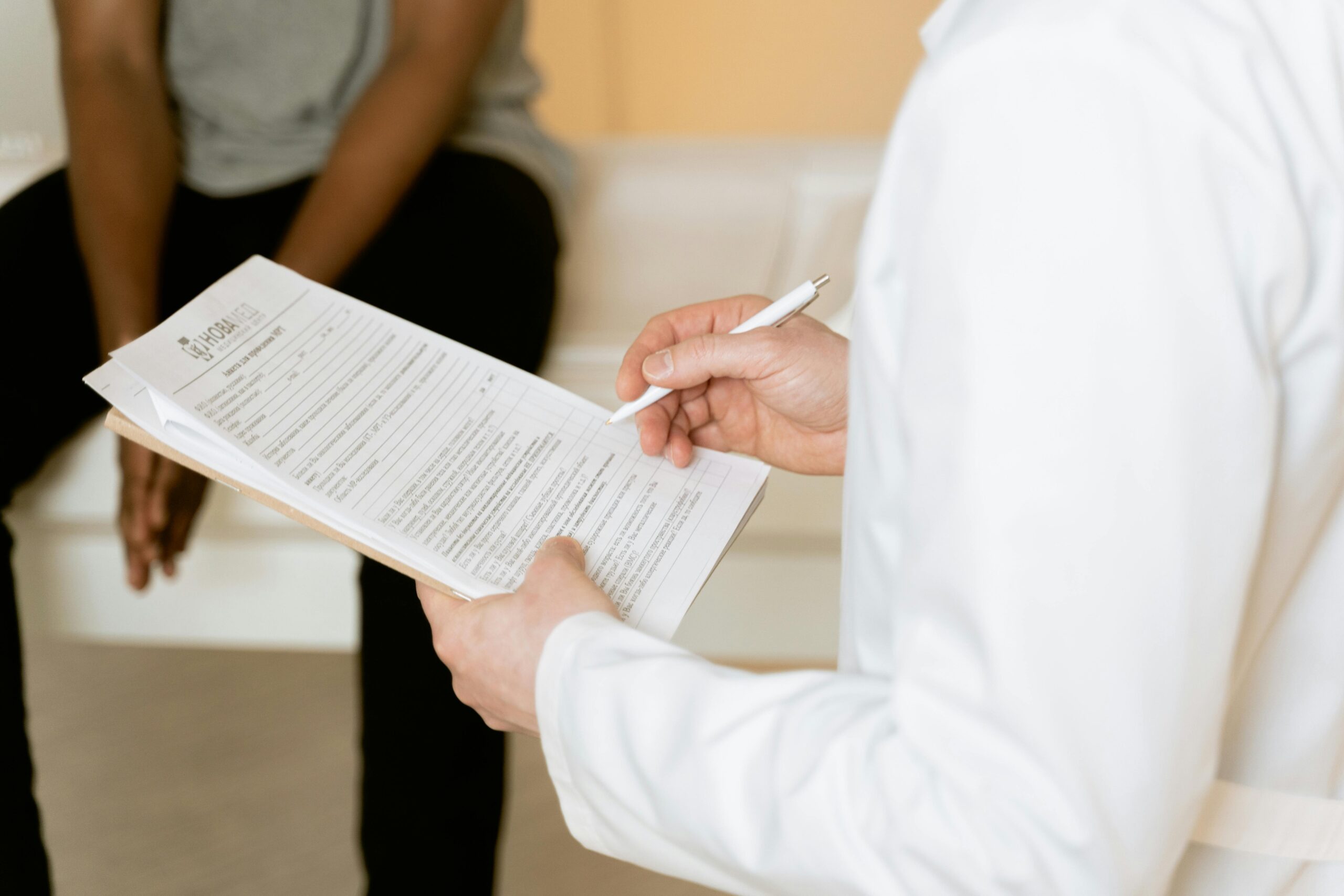 Medical professional consults patient notes